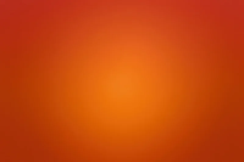 Smooth radial gradient transitioning from deep red-orange at edges to bright orange center