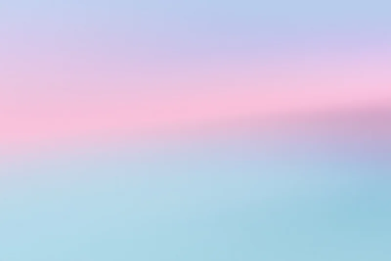 Smooth pastel gradient transitioning from pink to blue across the frame