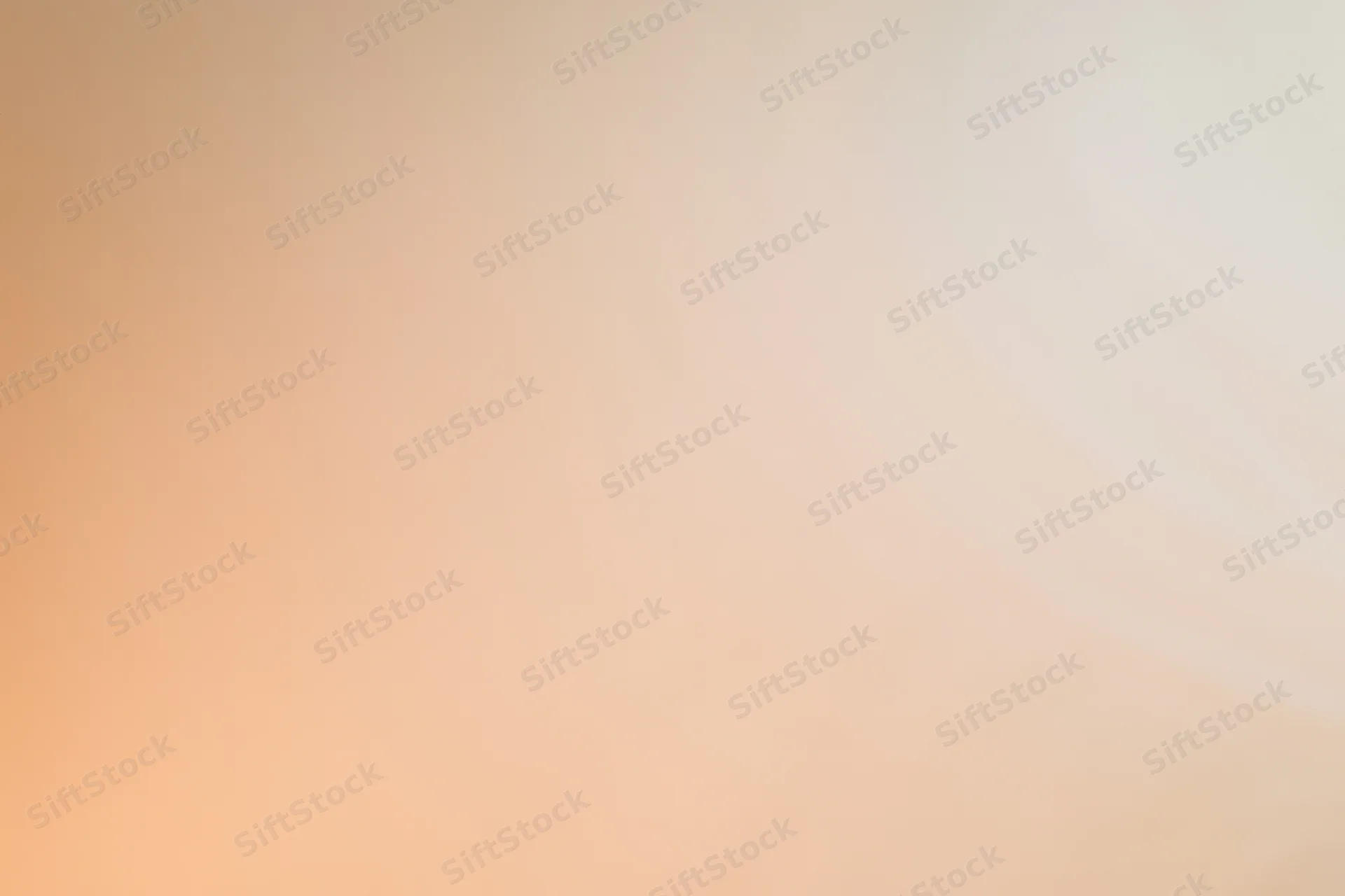 Smooth gradient background transitioning from warm peach to light orange