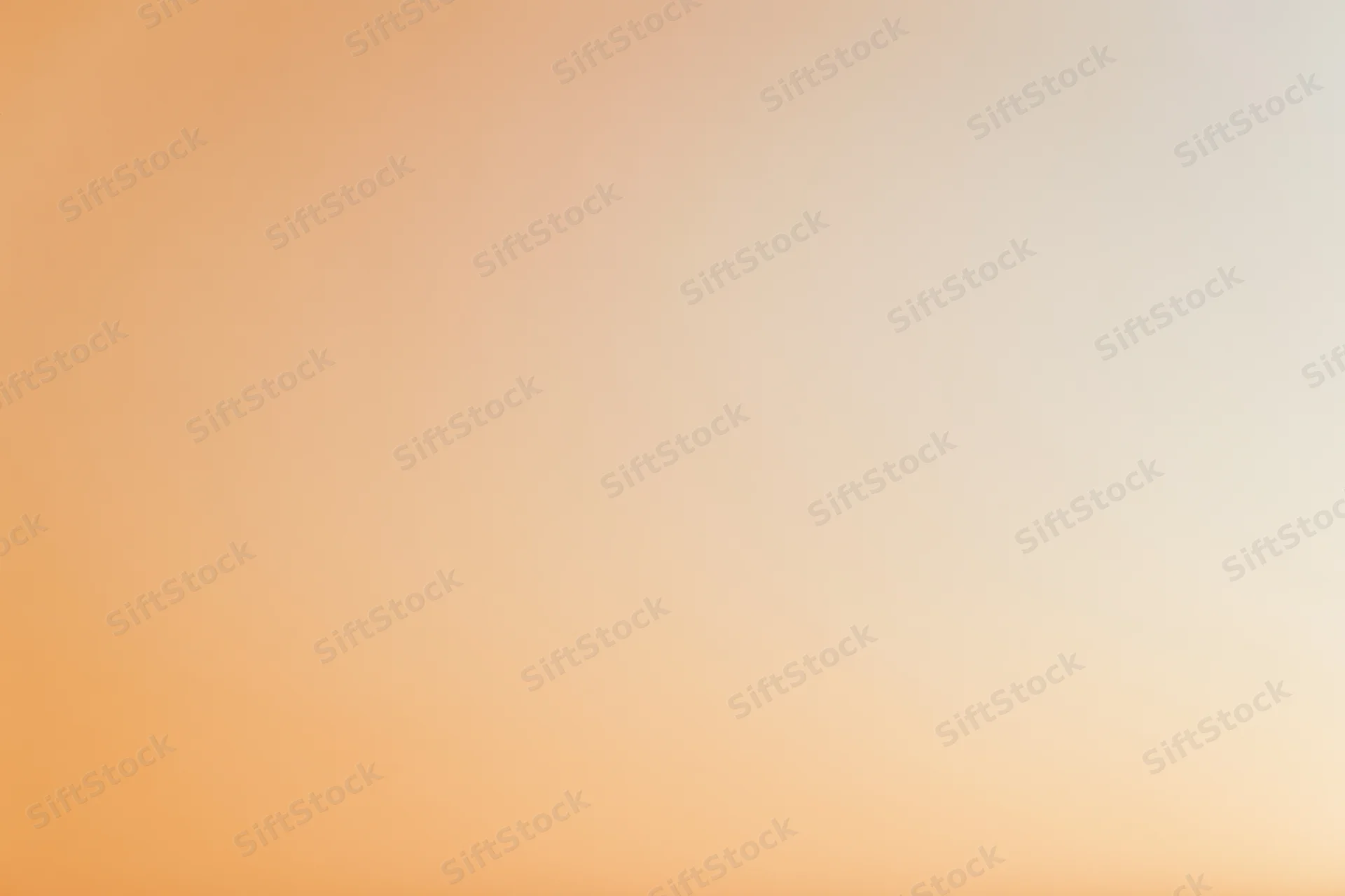 Smooth gradient background transitioning from warm peach to light orange