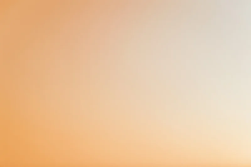 Smooth gradient background transitioning from warm peach to light orange