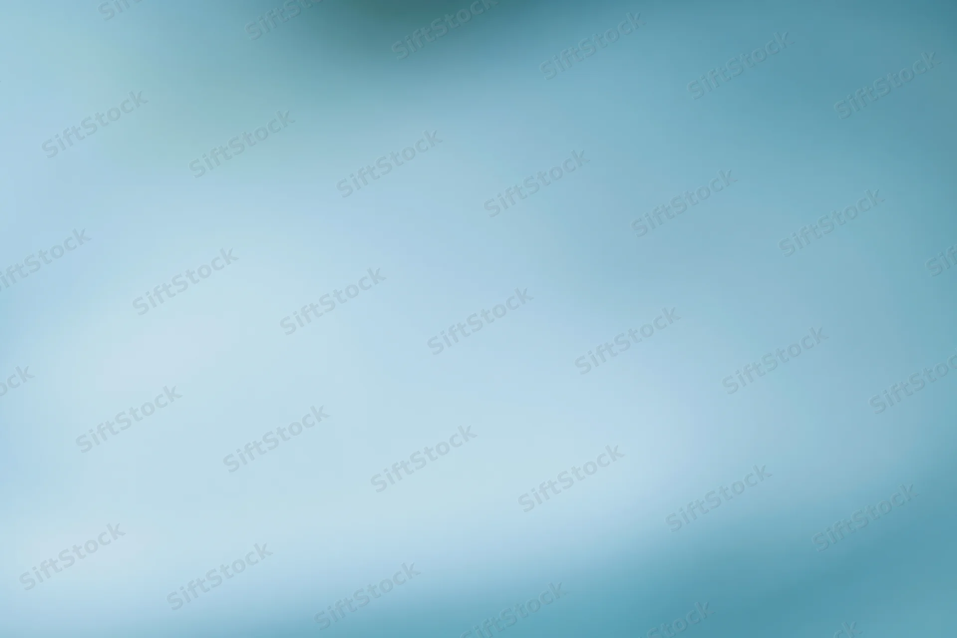 Smooth out-of-focus blue gradient background with soft color transition