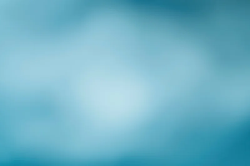 Smooth out-of-focus blue gradient background with soft light transition