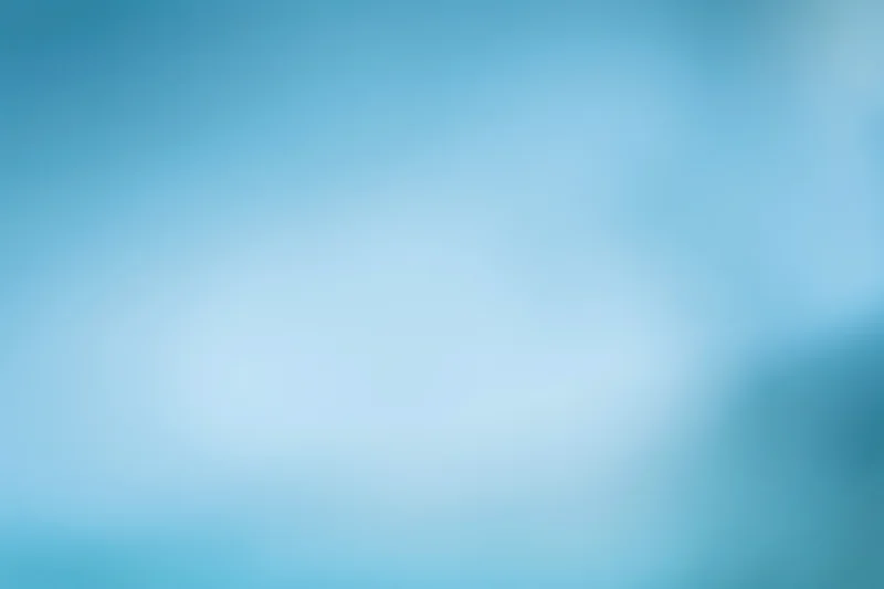 Smooth out-of-focus blue gradient background with soft light transitions
