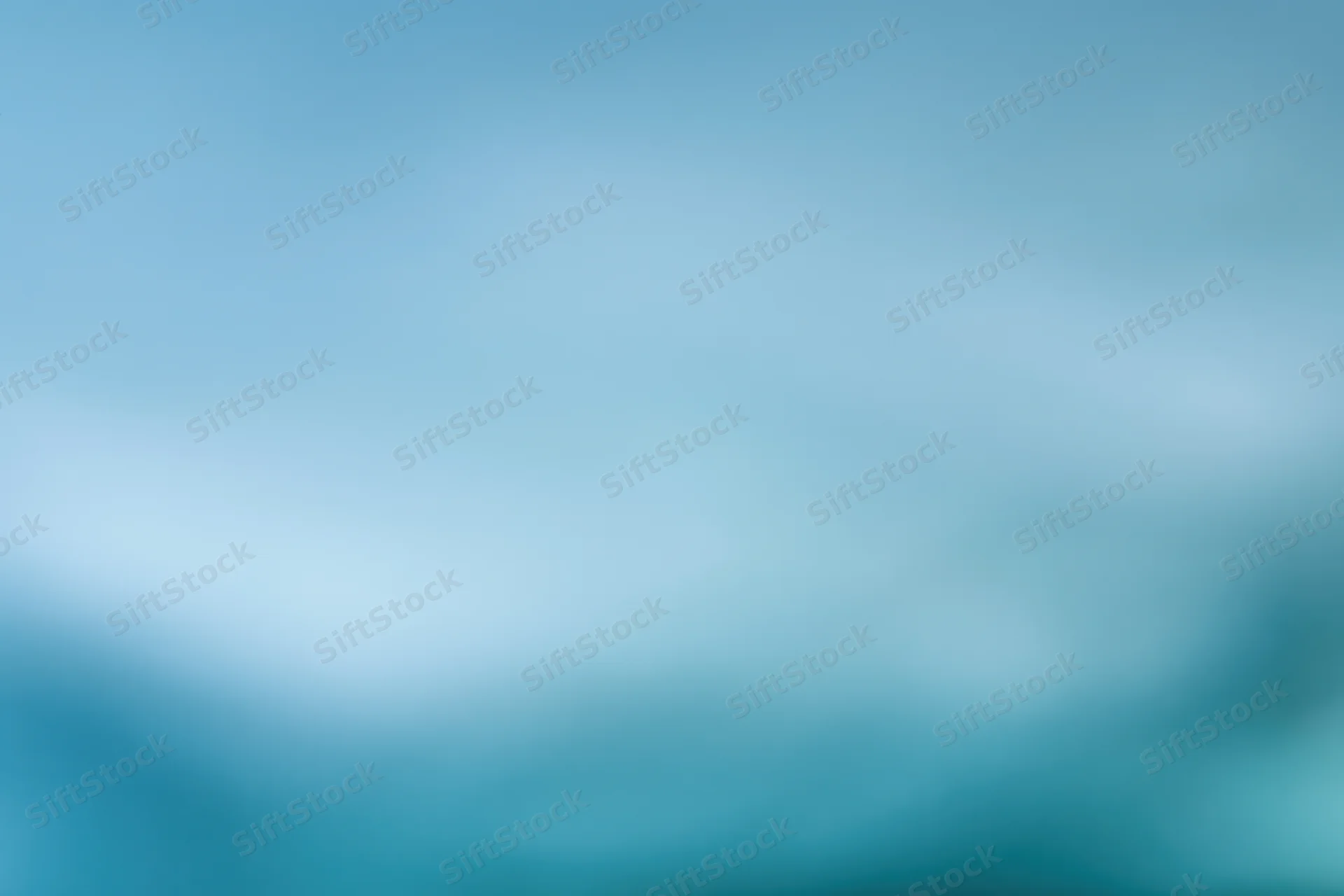 Smooth out-of-focus blue gradient background with soft color transition