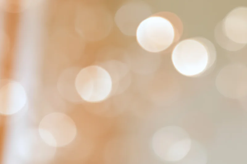 Bokeh Lights Creating Soft Warm Abstract Glow in Golden Tone