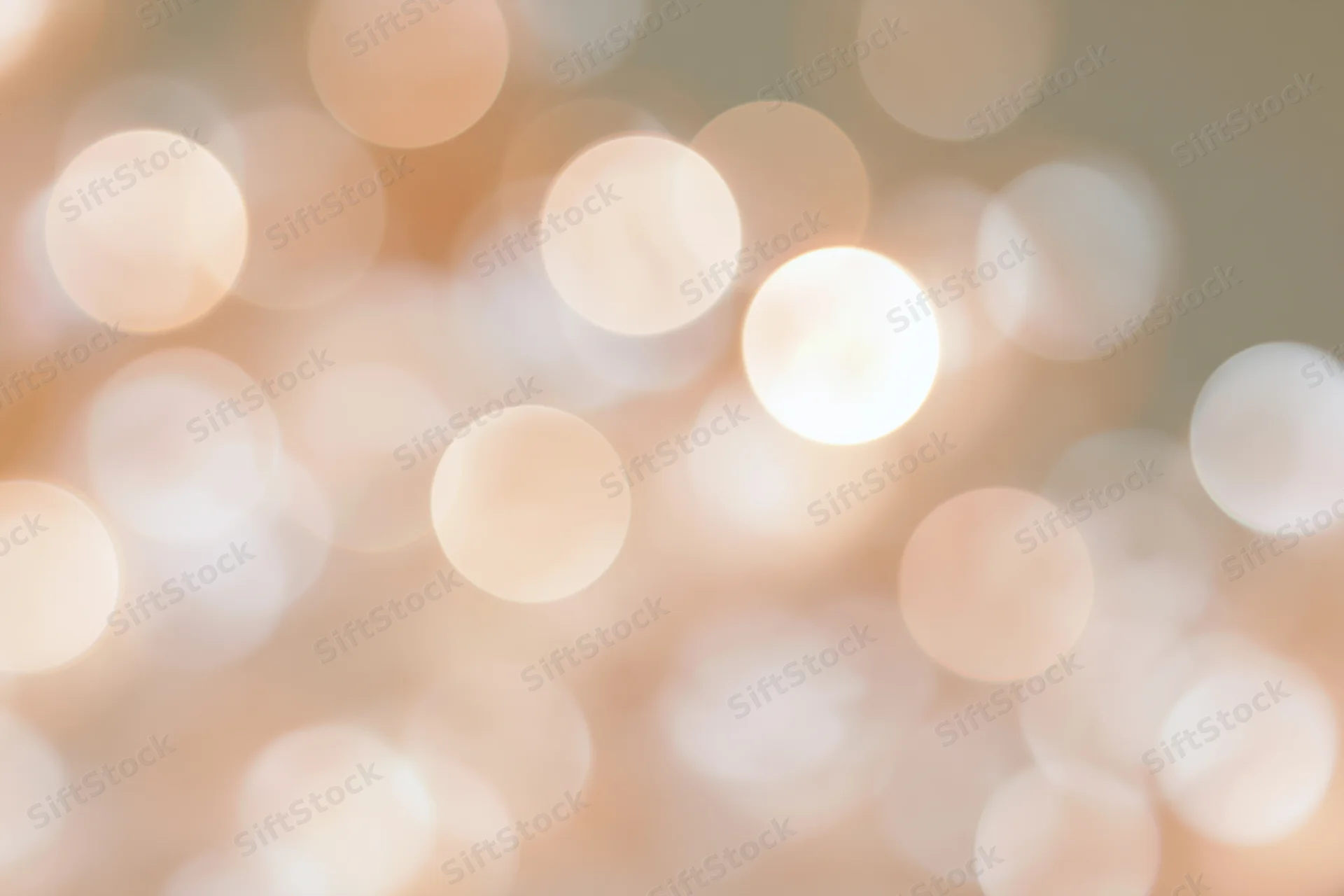 Soft abstract bokeh background with large out-of-focus warm lights