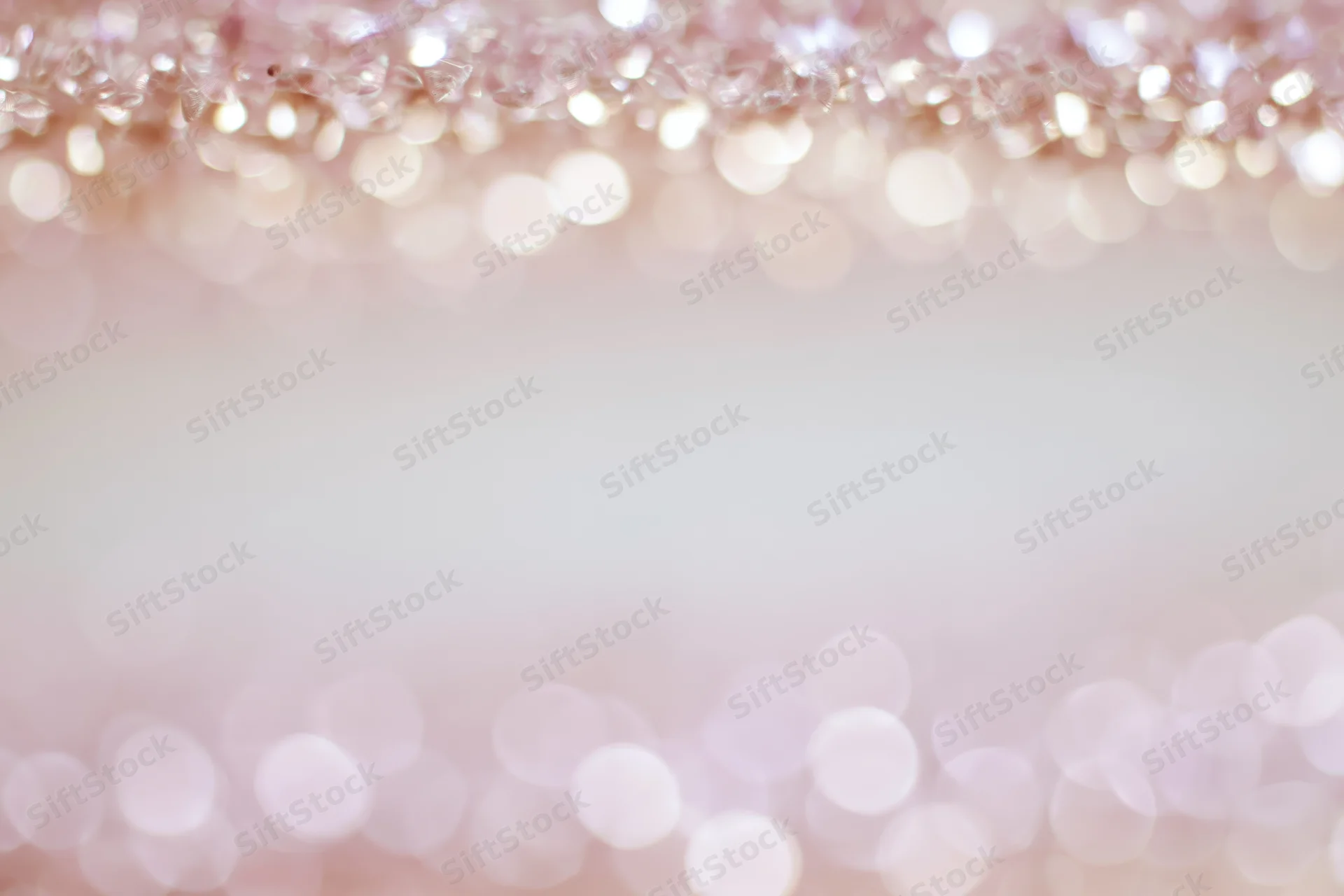 Soft abstract bokeh background with out-of-focus light orbs arranged in a frame border, leaving central copyspace