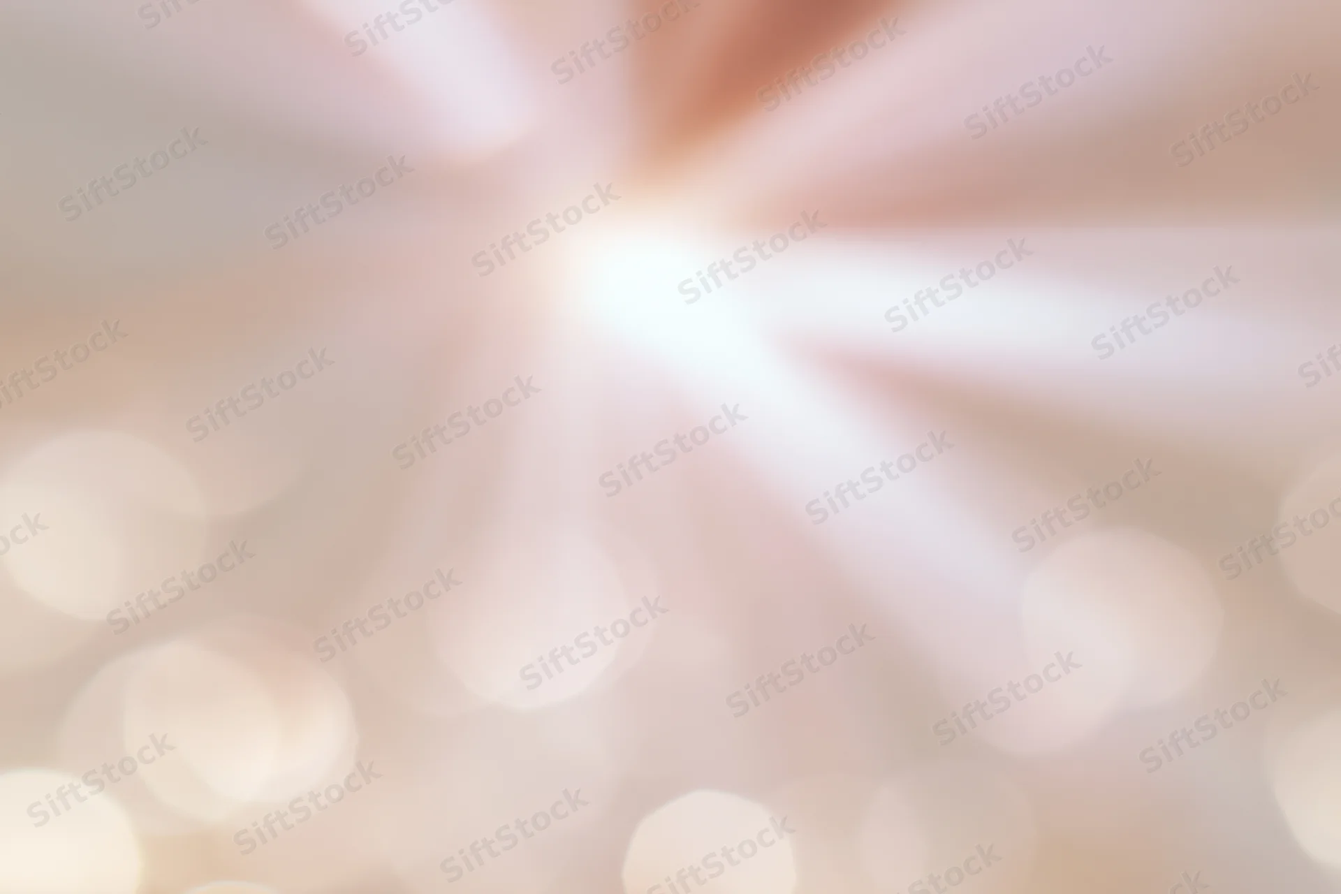 Soft blurred bokeh background with scattered circular lights radiating from center