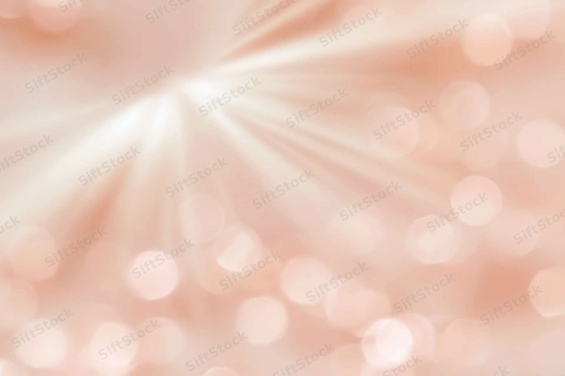 Soft blurred bokeh background with scattered circular light spots radiating from center