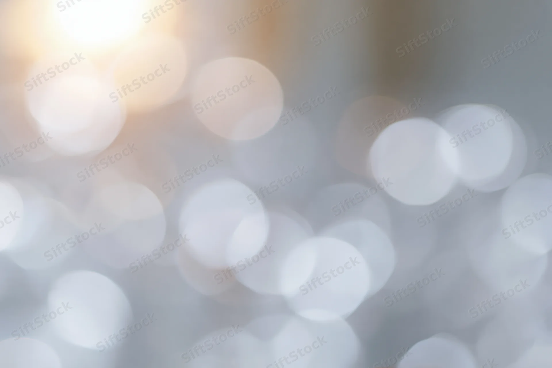 Soft out-of-focus light circles forming a glowing bokeh background