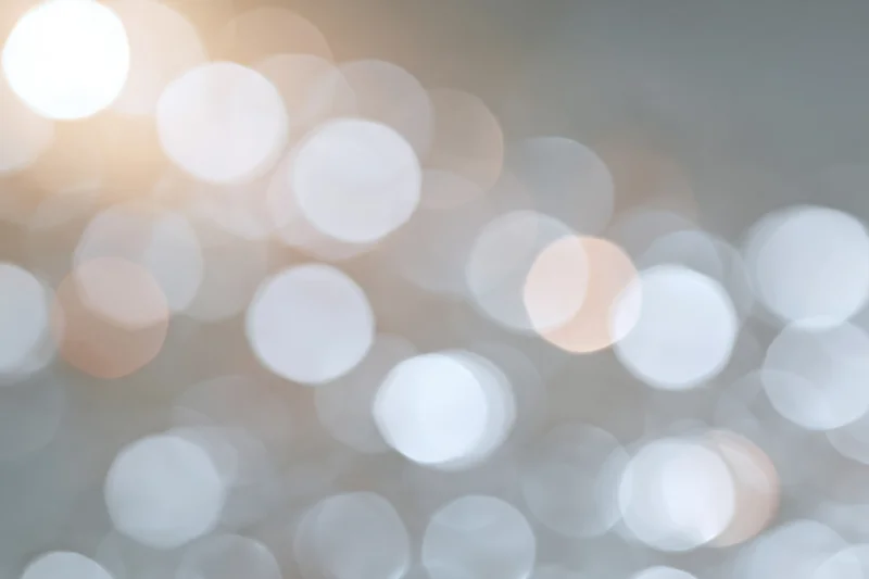 Soft out-of-focus light circles forming a blurred background with warm and cool tones