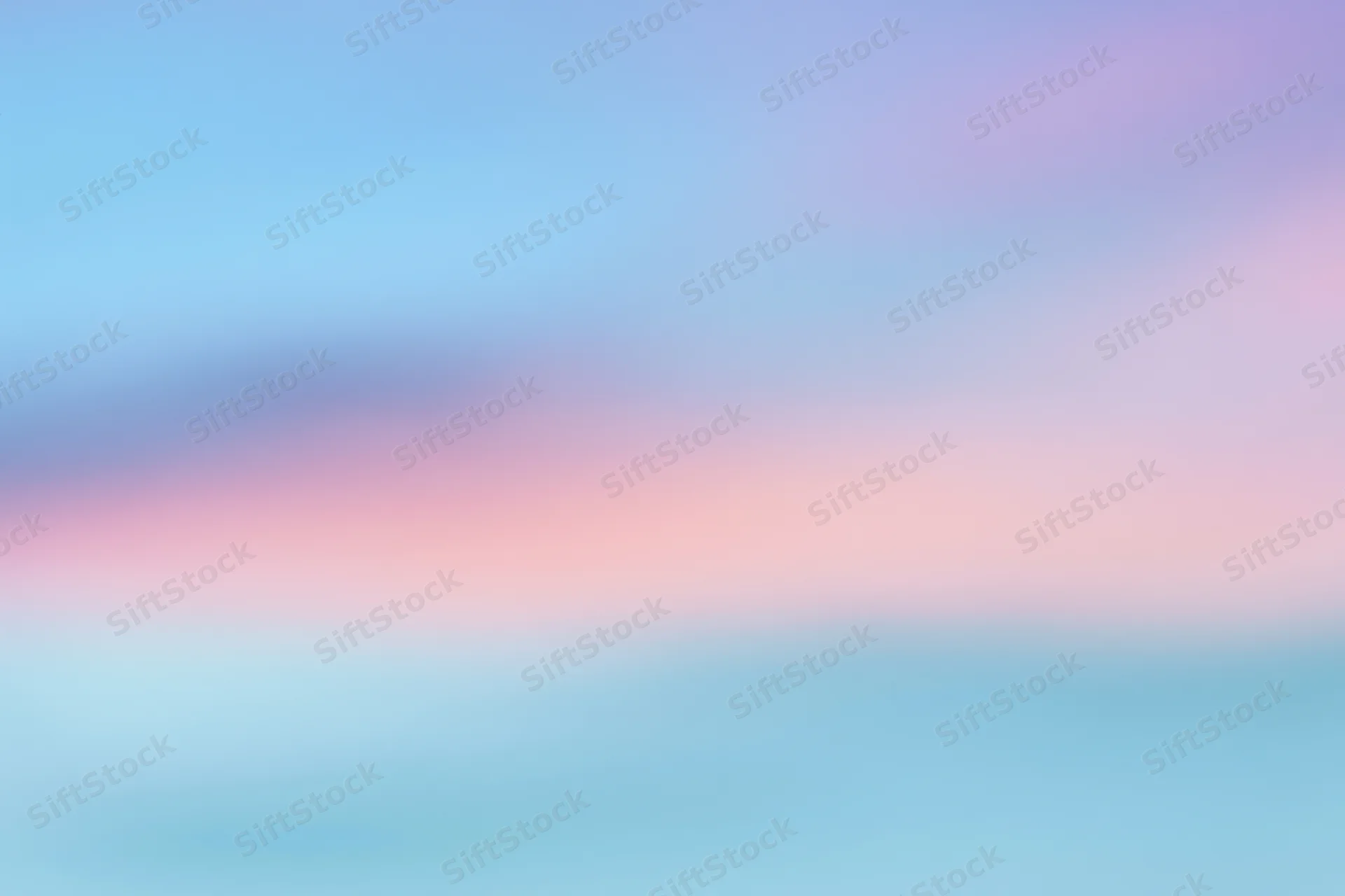 Soft blurred gradient of pastel colors transitioning from blue to pink and purple across the frame