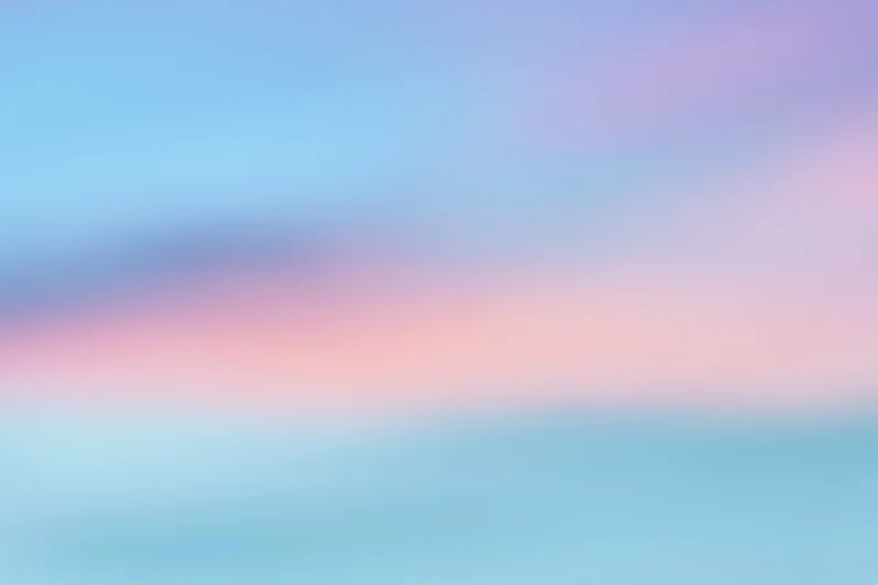 Soft blurred gradient of pastel colors transitioning from blue to pink and purple across the frame
