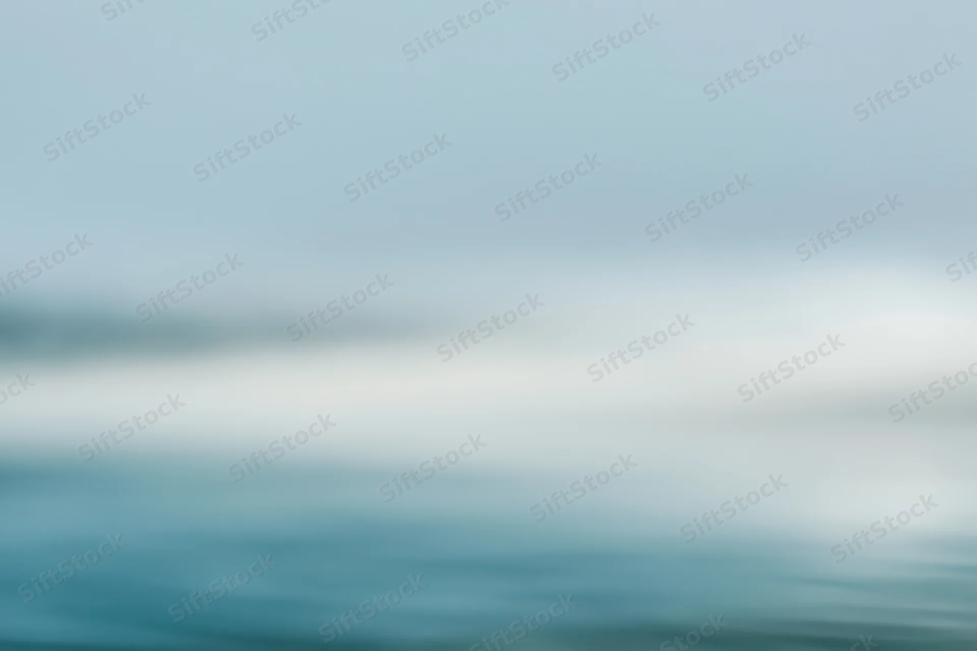 Soft blurred gradient of blue and white with smooth transitions across the frame