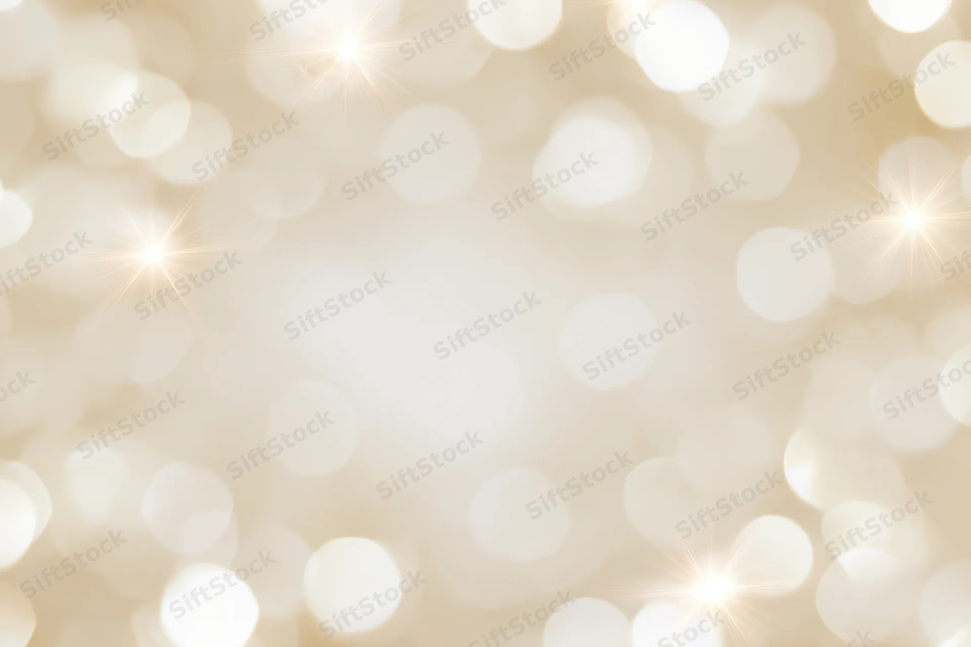 Soft out-of-focus bokeh background with scattered circular lights forming a warm golden glow and copyspace in the center