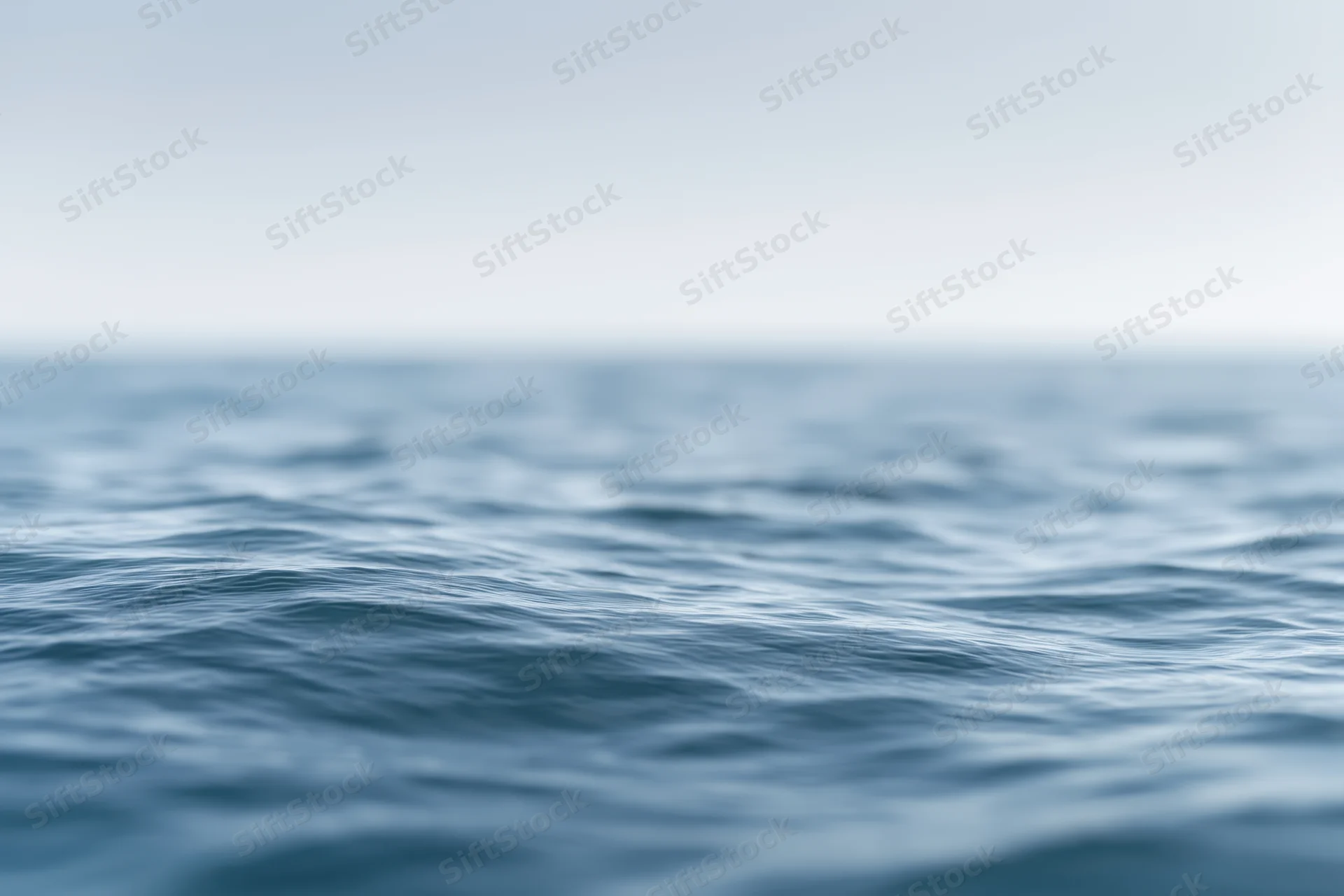 Blurred ocean surface with gentle ripples viewed from water level