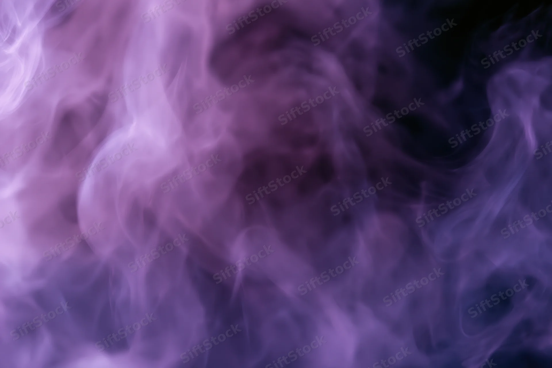 Swirling purple smoke filling the frame as an abstract background