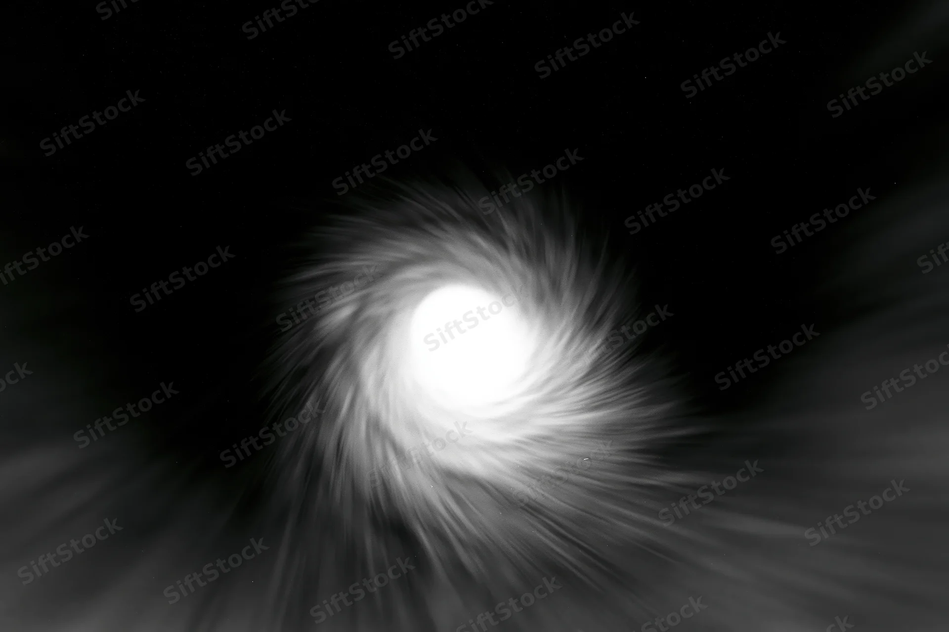 View from inside a dark circular tunnel looking toward a bright light at the center