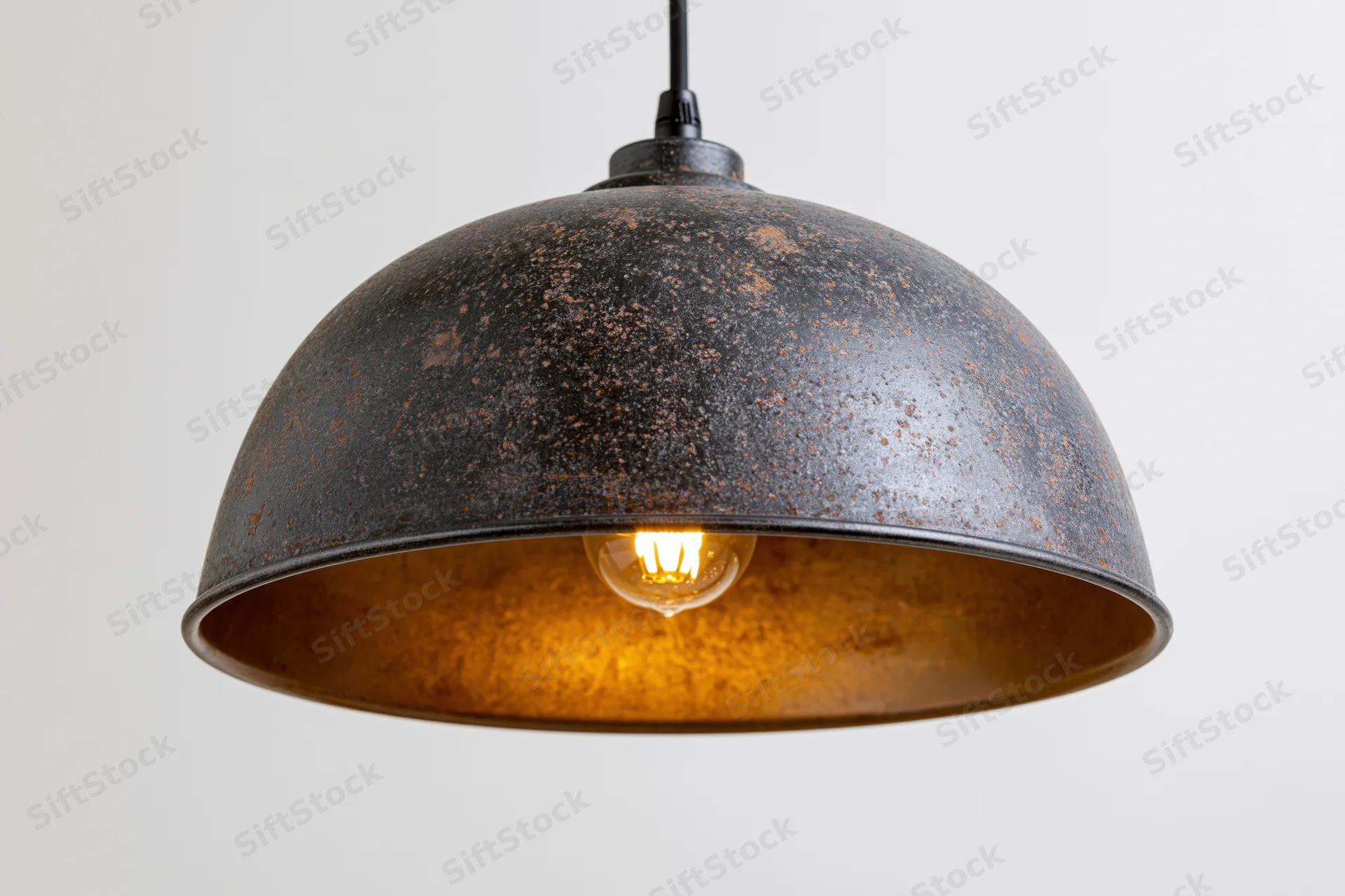 Vintage industrial dome pendant lamp hanging from ceiling with exposed edison bulb and rusted metal shade