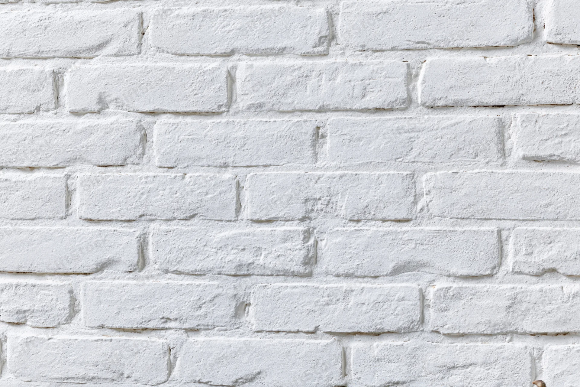 White-painted brick wall filling the frame as a seamless textured background