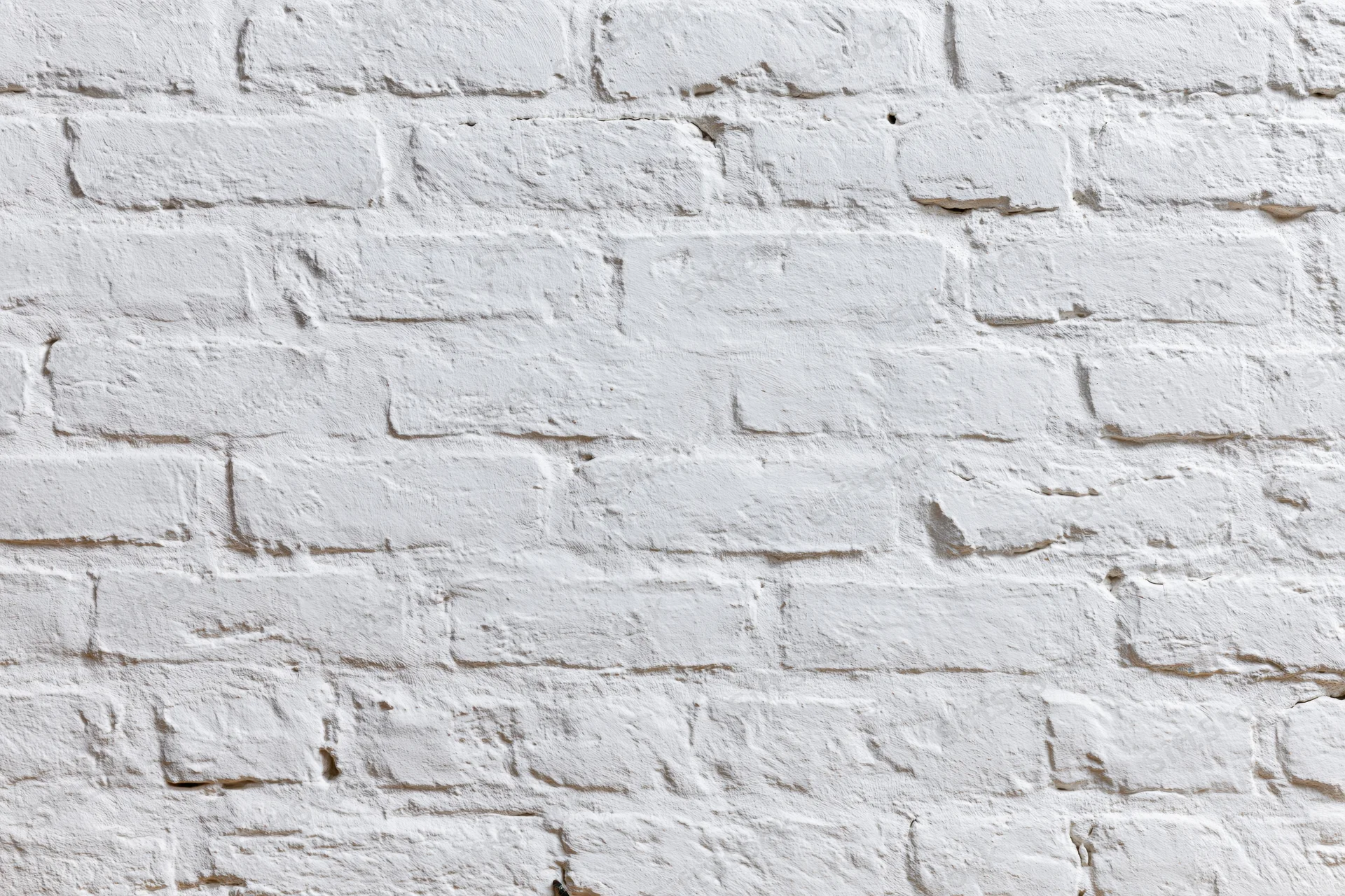 White-painted brick wall filling the frame as a textured background