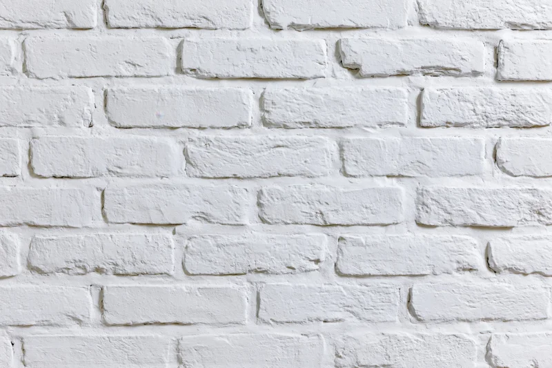 White-painted brick wall filling the frame as a textured background