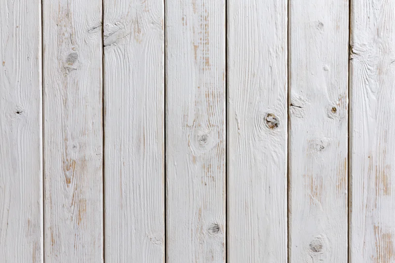 White-painted wooden planks arranged vertically filling the frame