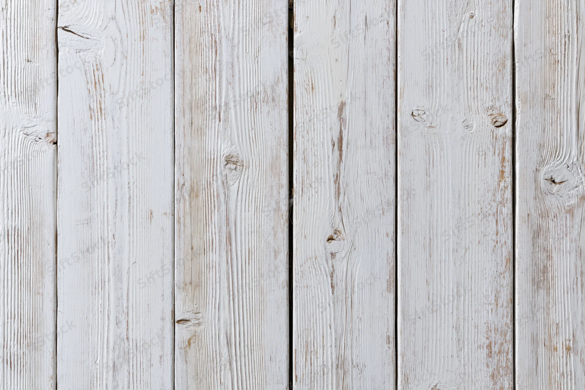 White-painted wooden planks arranged vertically filling the frame