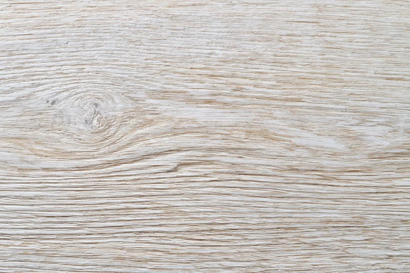 White-washed wooden surface filling the frame in flat lay view