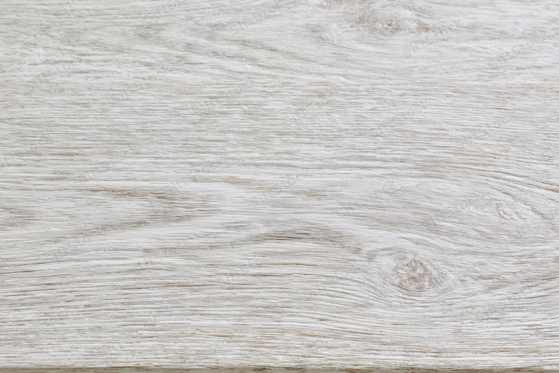 White-washed wooden surface filling the frame in flat lay arrangement