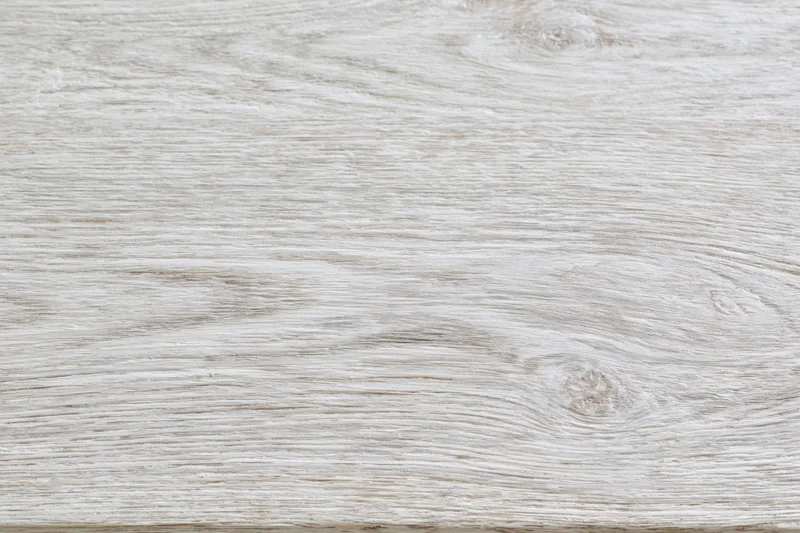 White-washed wooden surface filling the frame in flat lay arrangement