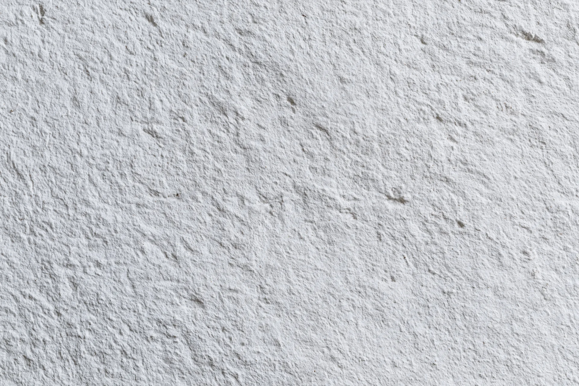 White painted concrete wall surface filling the frame