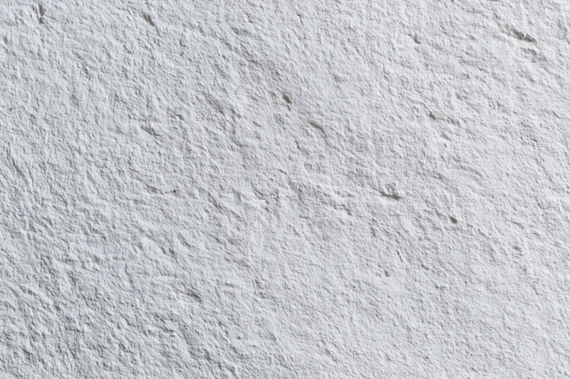 White painted concrete wall surface filling the frame