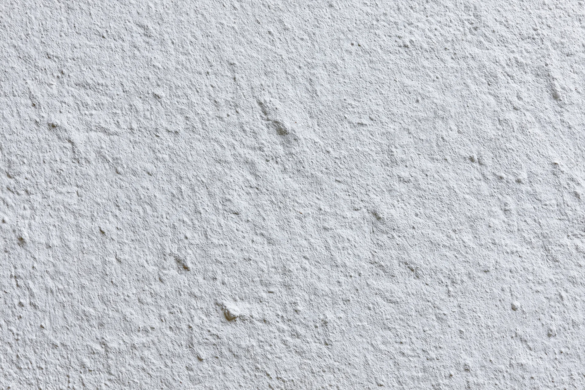 White painted concrete wall surface filling the frame