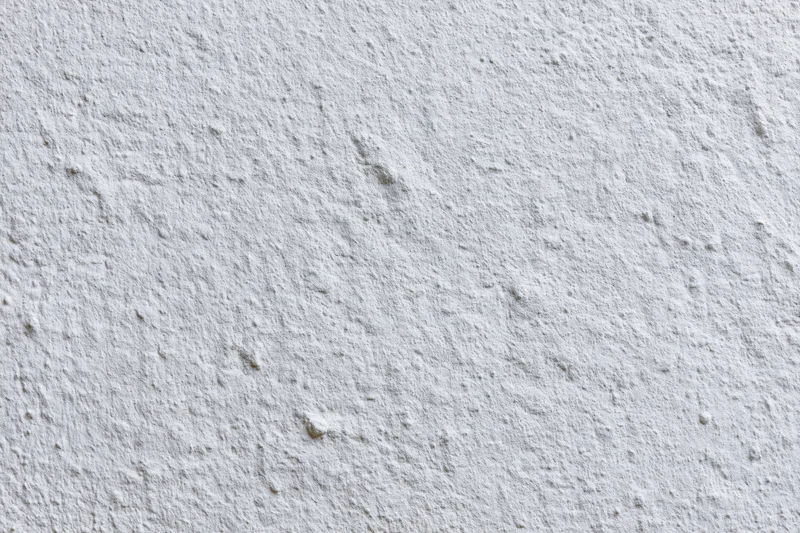 White painted concrete wall surface filling the frame