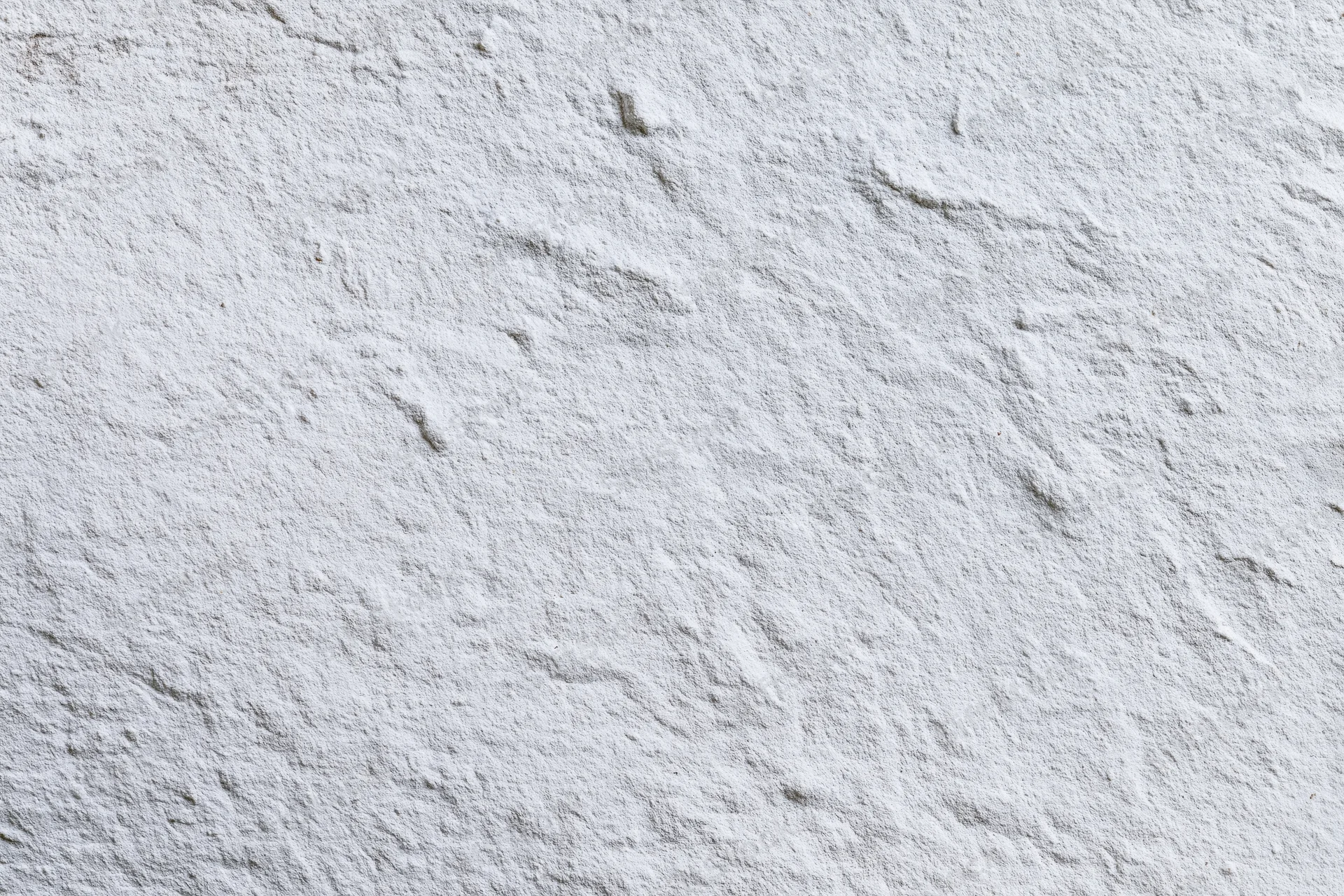White painted concrete wall surface filling the frame