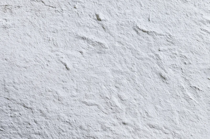 White painted concrete wall surface filling the frame