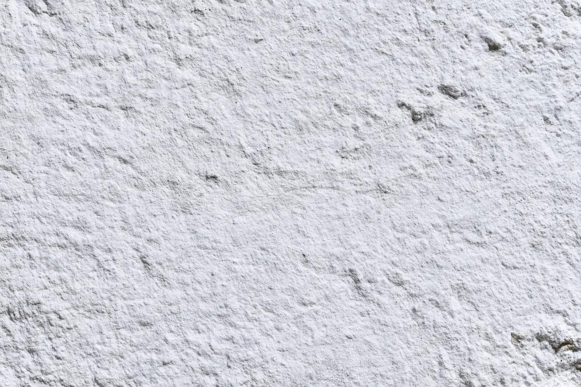 White painted concrete wall surface filling the frame