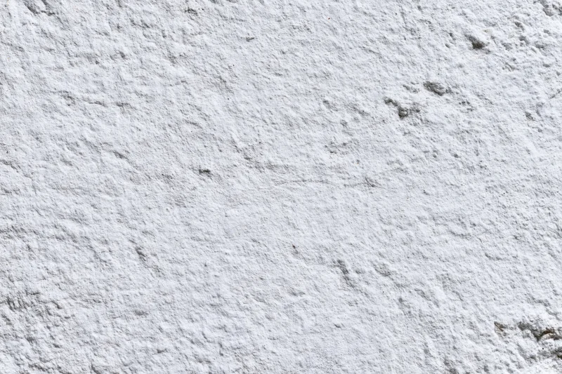 White painted concrete wall surface filling the frame