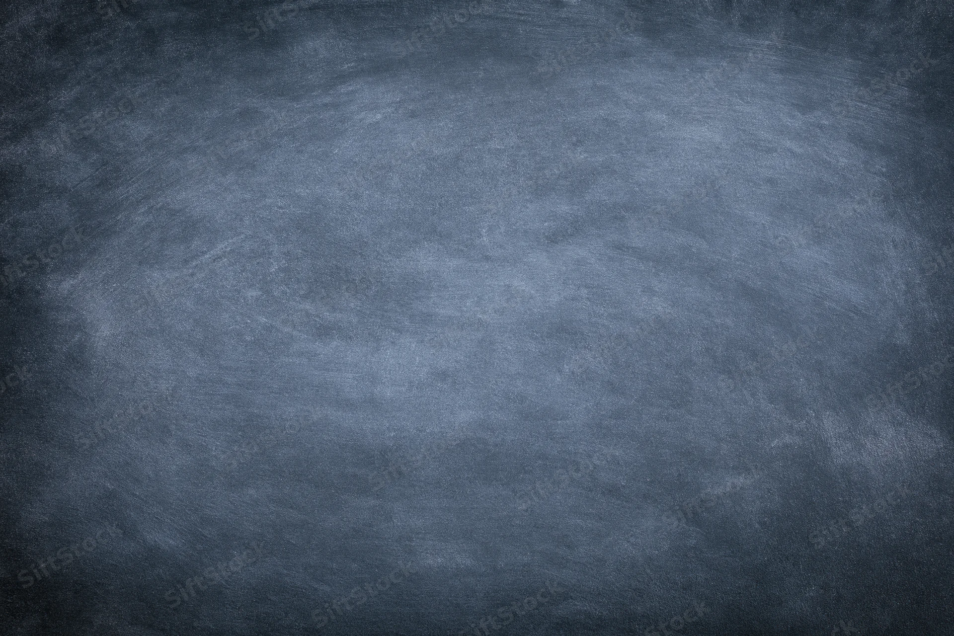 Worn chalkboard surface filling the frame in close-up view