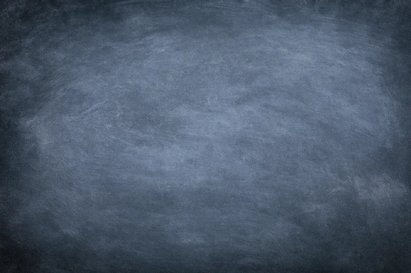 Worn chalkboard surface filling the frame in close-up view