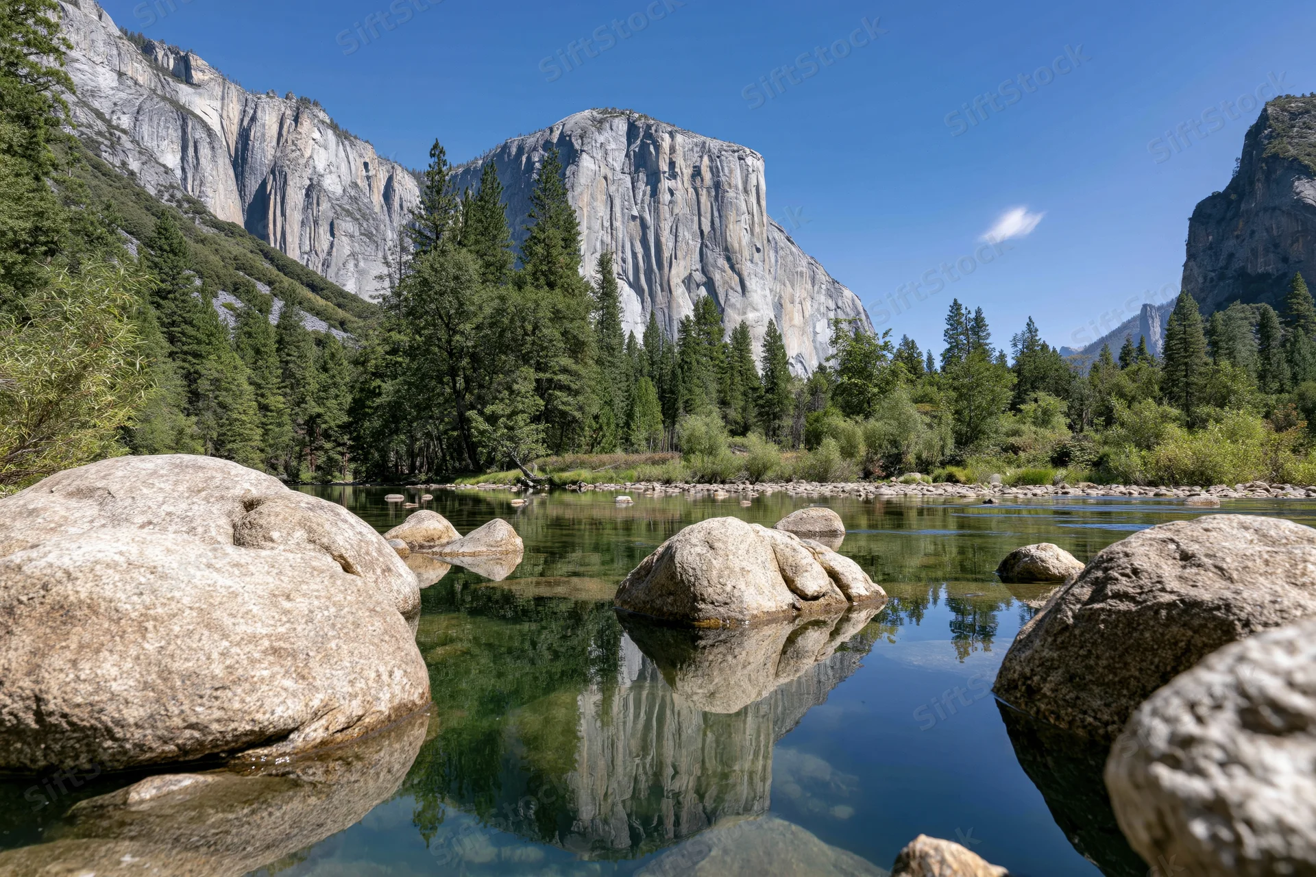 River view of granite cliffs and pine forest in yosemite valley