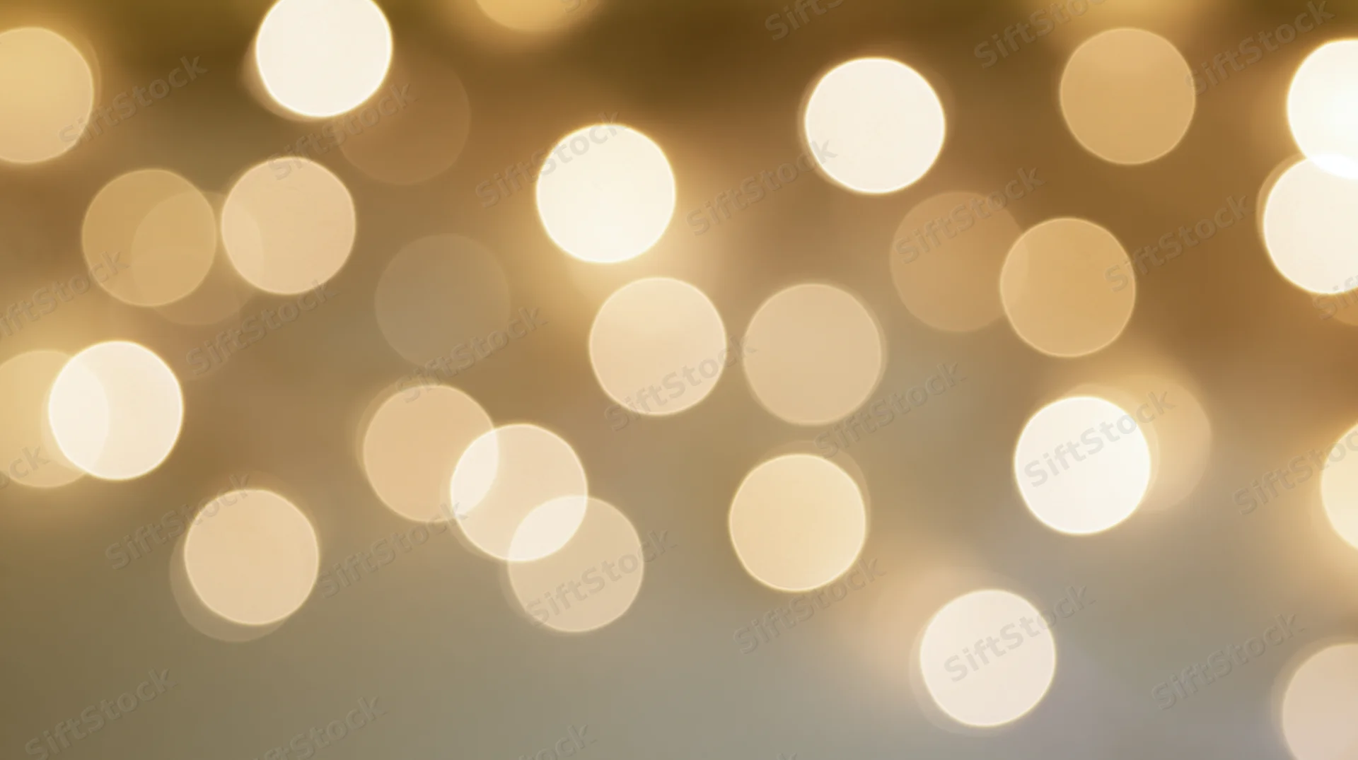Blurred golden lights arranged in a soft glowing pattern across the frame