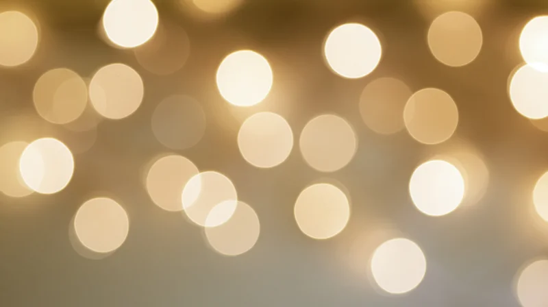 Blurred golden lights arranged in a soft glowing pattern across the frame