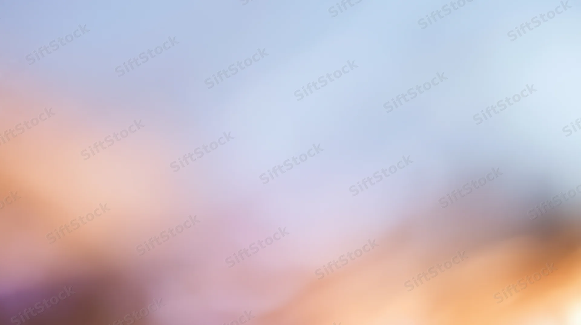 Soft blurred light gradient with warm and cool tones transitioning across the frame