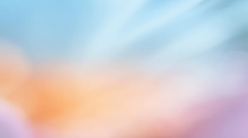 Soft pastel gradient background with blurred light streaks and dreamy bokeh effect