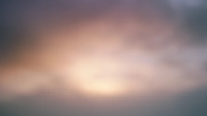 Soft glowing sky at twilight with hazy clouds and warm light gradient