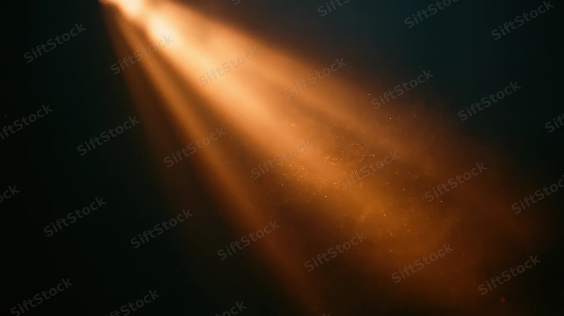 Warm light beams cutting through dust in a dark indoor space