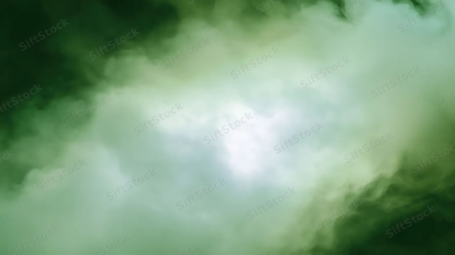 Swirling green smoke forming a soft luminous haze with diffuse light at center